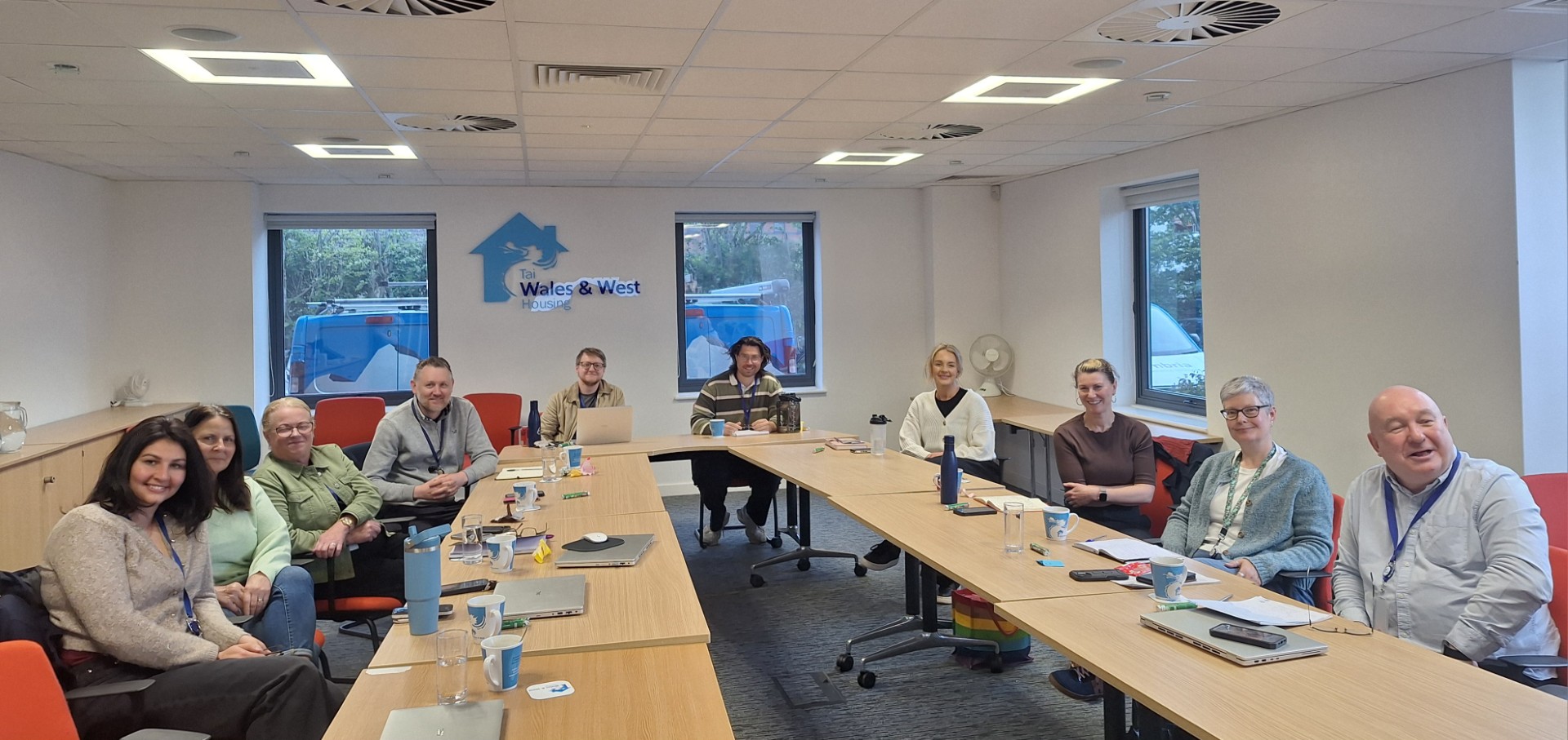 Professionals collaborating in a bright modern training workshop